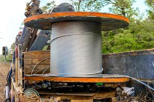 Coil with high-voltage cable mounted on wheeled truck photo