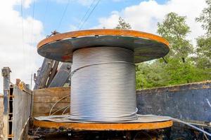Coil with high-voltage cable mounted on wheeled truck photo