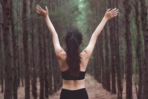 Women stretching arms and breathing fresh air