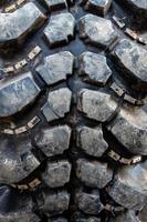 The texture of Centipede pattern mud terrain tire, Old used tires photo