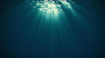 Rays of Sunlight Penetrate Clear Water.4K video