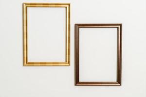 empty picture frame on white wall background photo