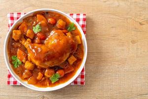 chicken stew with tomatoes, onions, carrot and potatoes photo