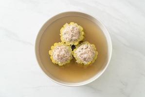 Stuffed bitter gourd with seasoned minced pork soup photo