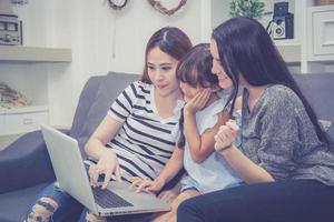 Family and daughter having time learning with using laptop computer. photo