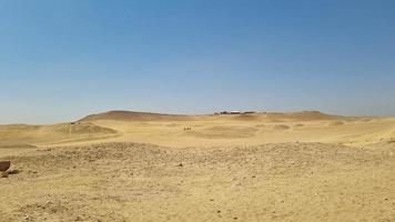 Sand dunes in the desert photo