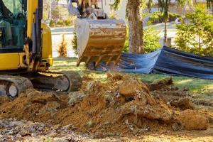 Excavator machine unloading soil earth moving