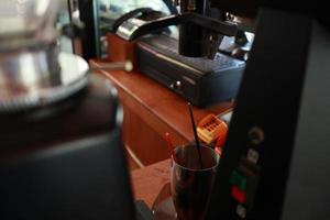 Professional coffee machine makes espresso.