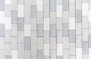 Concrete or paved newly laid gray paving slabs or stone