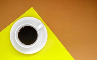 Black coffee in a white coffee cup on a gentle background. photo