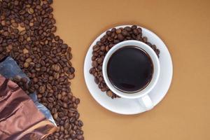 White cup of Americano black coffee without milk with a bunch of photo