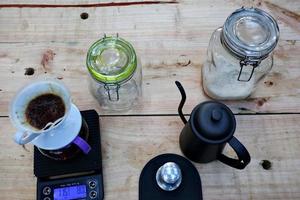 coffee drinks served on wooden tables, with added pine decorations photo