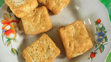 Fried tofu on a white plate, delicious food, white tofu photo