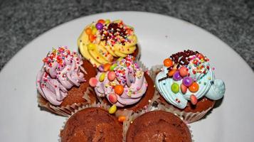 Close up view of various sweet cupcakes, bakery cake photo