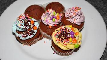 Close up view of various sweet cupcakes, bakery cake photo