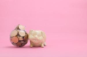 Saving money concept on pink background photo