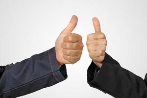 Thumbs up hand sign isolated on white photo