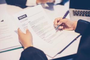 Businesswoman discussing document at a job interview photo