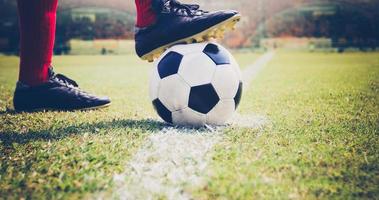 Soccer or football player with a ball photo