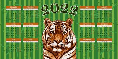 Calendar vector template for 2022 year with tiger and bamboo.