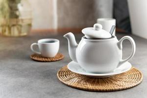 White porcelain tea cup and teapot, Afternoon tea table setting