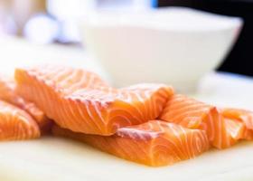 Fresh raw salmon on a plate at seafood market photo