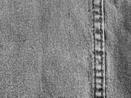 Texture and seam of denim fabric photo