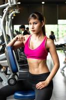 Young women exercise at the gym to strengthen the body photo