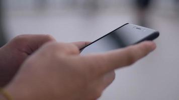 Close Up hands businessman using mobile typing message on smartphone. video