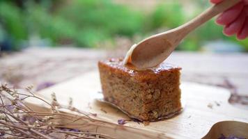 woman using spoon to eat carrot cake video