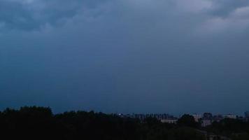 Bright lightning in dark night sky. Thunderstorm over city. Climate change, environmental problems. Stormy clouds and rainy weather. video