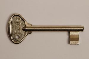 The old mechanical lock key used in the interior doors of the houses. photo