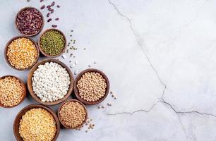 legumes in wooden bowls top view flat lay with copy space photo