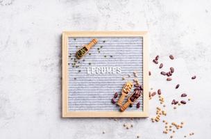 legumes with felt letter board with the text Legumes top view flat lay photo