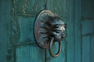 Antique door handle in the form of a lion