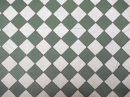 Green and white tiled floor photo