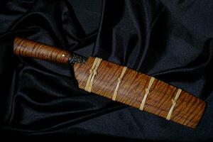 knife custom or Enep in the natural wood scabbard on old table background handmade of Thailand photo