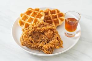 fried chicken waffle with honey or maple syrup photo