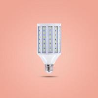 Lámpara de ahorro de energía led 230v aislado sobre fondo de color naranja pastel foto