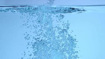 Underwater splash and bubbles in slow motion video