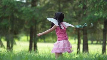 Girl in fairy princess costume blowing bubbles, shot on Phantom Flex 4K video