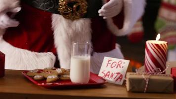 Santa Claus has some milk and cookies video