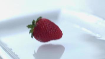 Strawberry splashing in slow motion video