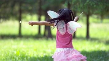 Girl in fairy princess costume spins holding dandelions, shot on Phantom Flex 4K