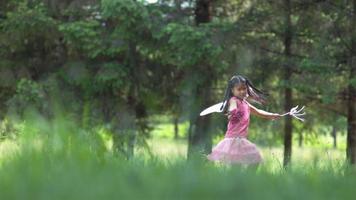 Girl in fairy princess costume running in grass, shot on Phantom Flex 4K video