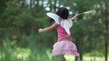 Girl in fairy princess costume blowing bubbles, shot on Phantom Flex 4K video
