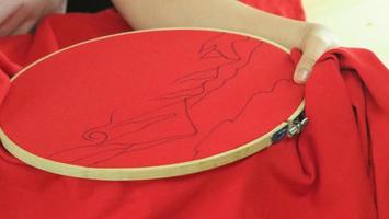 Embroider sewing by woman hand. Craft work and female hands. photo