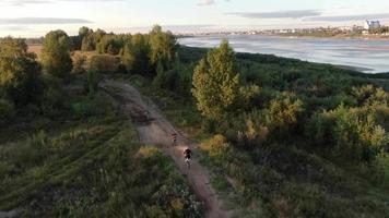 Aerial filming of racing motocross bikes in Tomsk. Siberia, Russia. video