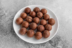 Macadamia nuts close up. It can be used as a background photo