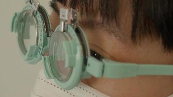 Eye testing and eyeglass assembly by experts optician. video